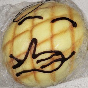 Laughing face pineapple bread pan Chocolate scented large squishy toy cell strap